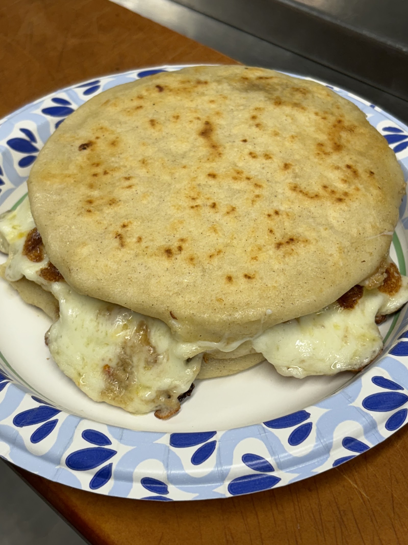 Cheese-filled pupusa, hot off the comal