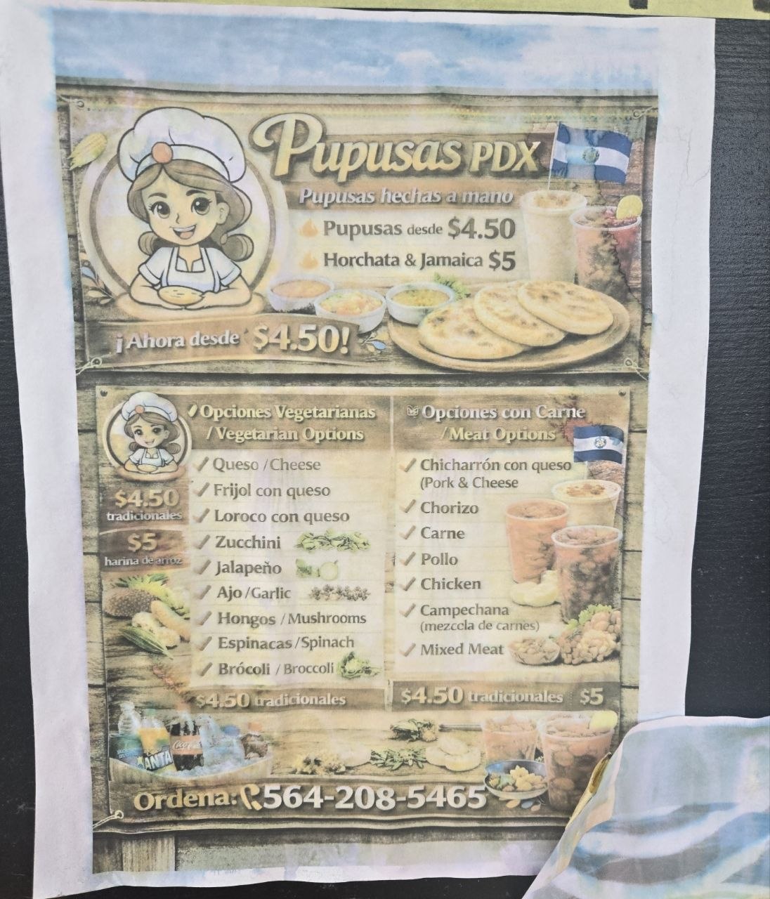 Hand-painted Pupusas PDX menu with cartoon mascot
